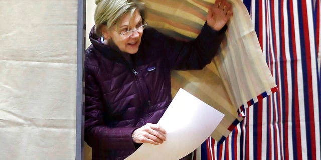 Democratic presidential candidate Sen. Elizabeth Warren, D-Mass., emerges from the booth with her ballot as she votes on Tuesday, March 3, 2020, in Cambridge, Mass. (AP Photo/Steven Senne)