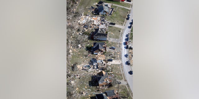 Destroyed homes line a street Tuesday, March 3, 2020, near Lebanon, Tenn. Tornadoes ripped across Tennessee early Tuesday, shredding more than 140 buildings and burying people in piles of rubble and wrecked basements. (AP Photo/Mark Humphrey)