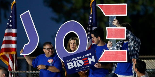 Supporters hold a sign before a campaign rally for Democratic presidential candidate former Vice President Joe Biden on Tuesday, March 3, 2020, in Los Angeles. (AP Photo/Marcio Jose Sanchez)
