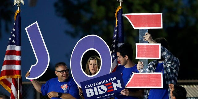 Supporters hold a sign before a campaign rally for Democratic presidential candidate former Vice President Joe Biden on Tuesday, March 3, 2020, in Los Angeles. (AP Photo/Marcio Jose Sanchez)