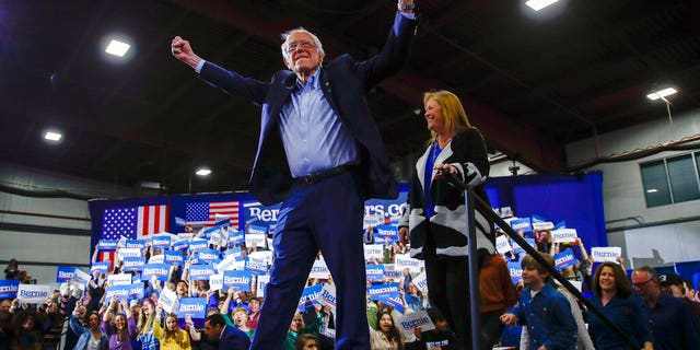 Democratic presidential candidate Sen. Bernie Sanders, I-Vt., accompanied by his wife Jane O'Meara Sanders, speaks during a primary night election rally in Essex Junction, Vt., Tuesday, March 3, 2020. (AP Photo/Matt Rourke)