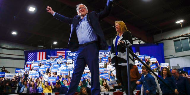 Democratic presidential candidate Sen. Bernie Sanders, I-Vt., accompanied by his wife Jane O'Meara Sanders, speaks during a primary night election rally in Essex Junction, Vt., Tuesday, March 3, 2020. (AP Photo/Matt Rourke)