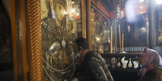 People visit the Church of the Nativity in Bethlehem, West Bank, Thursday, March 5, 2020. (AP Photo/Mahmoud Illean)