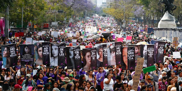 Women march during International Women's Day in Mexico City, Sunday, March 8, 2020.
