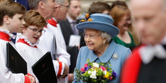 Britain's Queen Elizabeth II leaves after attending the annual Commonwealth Day service at Westminster Abbey in London, Monday, March 9, 2020. 