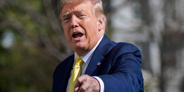 President Donald Trump gestures while walking on the South Lawn of the White House in Washington on Monday after stepping off Marine One. A “Women for Trump” bus tour has been canceled, the president’s campaign said, citing scheduling conflicts. (AP Photo/Patrick Semansky)