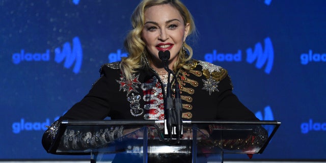 FILE - In this May 4, 2019, file photo, honoree Madonna accepts the advocate for change award at the 30th annual GLAAD Media Awards at the New York Hilton Midtown in New York. Madonna has canceled the last two stops of her latest tour in France after the country said it was banning events of more than 1,000 people to limit the spread of the coronavirus.