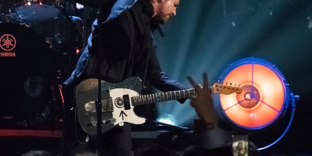 In this Friday, April 7, 2017, file photo, inductee Eddie Vedder from the band Pearl Jam performs at the 2017 Rock and Roll Hall of Fame induction ceremony at the Barclays Center in New York. Pearl Jam is postponing multiple U.S. and Canadian shows on their Gigaton tour because of coronavirus concerns.