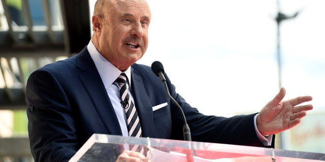 This Feb. 21, 2020 file photo shows talk show host Dr. Phil McGraw speaking during a ceremony awarding him with a star on the Hollywood Walk of Fame in Los Angeles. (AP Photo/Chris Pizzello, File)