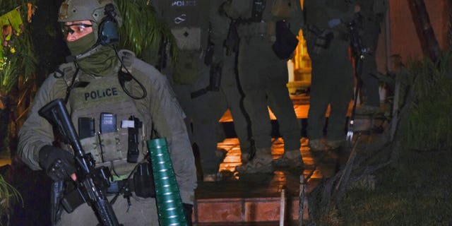 DEA agents ransack a residential home during the arrest of a suspected drug trafficker on Wednesday, March 11, 2020 in Diamond Bar, California.