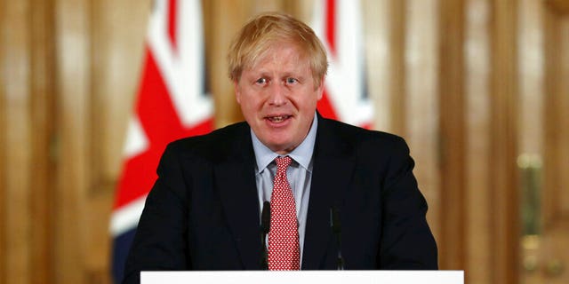 Britain's Prime Minister Boris Johnson holds a news conference giving the government's response to the new COVID-19 coronavirus outbreak, at Downing Street in London, Thursday March 12, 2020. (Simon Dawson/Pool via AP)