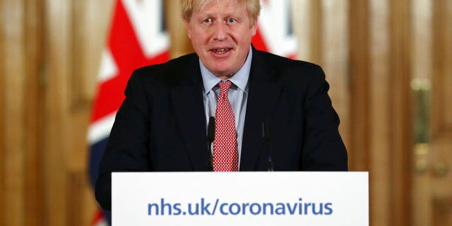 Britain's Prime Minister Boris Johnson holds a news conference giving the government's response to the new COVID-19 coronavirus outbreak, at Downing Street in London, Thursday March 12, 2020. (Simon Dawson/Pool via AP)