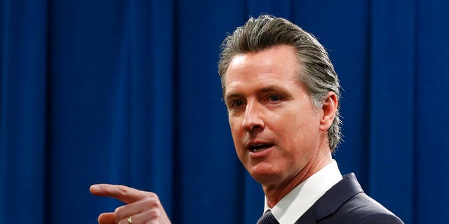 California Gov. Gavin Newsom speaks to reporters about his executive order advising that non-essential gatherings of more than 250 people should be canceled until at least the end of March, during a news conference in Sacramento, Calif., Thursday, March 12, 2020.