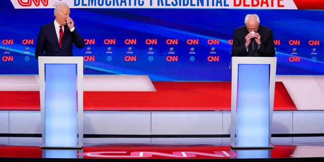 Sanders attacks Biden record as one-on-one debate turns personal: ‘Don’t laugh, Joe’ 2 Former Vice President Joe Biden, left, and Sen. Bernie Sanders, I-Vt., right, wipes their faces with tissues as they wait to participate in a Democratic presidential primary debate at CNN Studios in Washington, Sunday, March 15, 2020. (AP Photo/Evan Vucci)
