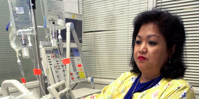 FILE: Lovely R. Suanino, a respiratory therapist at Newark Beth Israel Medical Center in Newark, N.J., demonstrates setting up a ventilator in the intensive care unit of the hospital. 