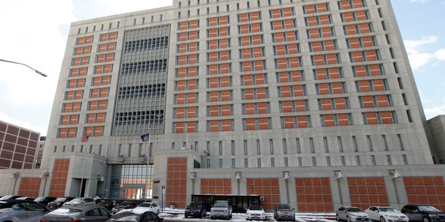 FILE- This Jan. 8, 2017 file photo shows the Metropolitan Detention Center in the Brooklyn borough of New York. The federal Bureau of Prisons announced on Saturday, March 20, 2020, that an inmate at the federal jail has tested positive for coronavirus, marking the first confirmed case in the federal prison system. (AP Photo/Kathy Willens, File)