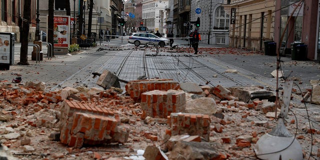 Police guard a street after an earthquake in Zagreb, Croatia, Sunday, March 22, 2020. A strong earthquake shook Croatia and its capital on Sunday, causing widespread damage and panic.(Associated Press)