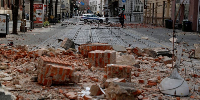 Police guard a street after an earthquake in Zagreb, Croatia, Sunday, March 22, 2020. A strong earthquake shook Croatia and its capital on Sunday, causing widespread damage and panic.(Associated Press)