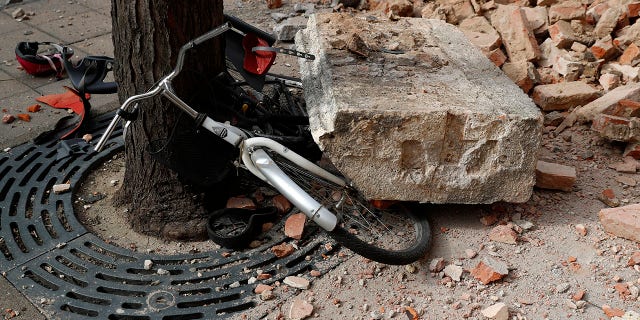 A bicycle is crushed by falling debris after an earthquake in Zagreb, Croatia, Sunday, March 22, 2020. A strong earthquake shook Croatia and its capital on Sunday, causing widespread damage and panic .(Associated Press)