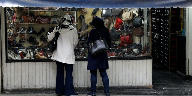 Iran refuses to release Christian prisoners amid coronavirus outbreak while EU sends millions in aid 4 Two women look at shoes of a shop in a mostly empty street in a commercial district in downtown Tehran, Iran, Sunday, March 22, 2020. On Sunday, Iran imposed a two-week closure on major shopping malls and centers across the country to prevent spreading the new coronavirus. Pharmacies, supermarkets, groceries and bakeries will remain open. (AP Photo/Vahid Salemi)