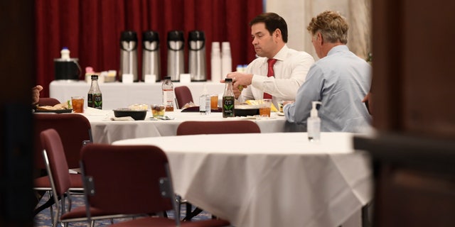Sen. Rand Paul, R-Ky., right, sat near Sen. Marco Rubio, R-Fla., at a Republican policy lunch on Capitol Hill this past Friday, two days before Paul announced he tested positive for the coronavirus. (AP Photo/Susan Walsh)