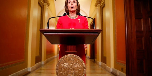 House Speaker Nancy Pelosi of Calif. speaks outside her office on Capitol Hill, Monday, March 23, 2020. (AP Photo/Andrew Harnik, Pool)