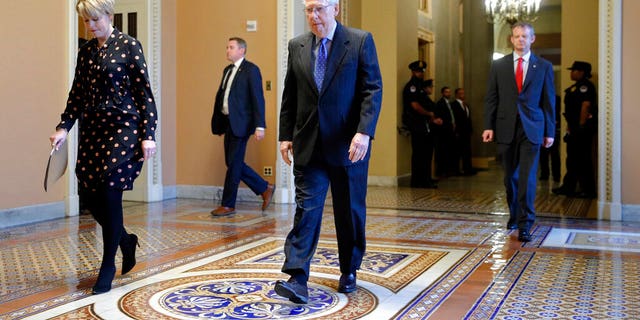 Senate Majority Leader Mitch McConnell of Ky. walks to the Senate chamber on Capitol Hill in Washington, Tuesday, March 24, 2020. (AP Photo/Patrick Semansky)