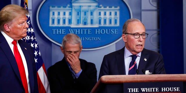 Trump says there's 'light at the end of the tunnel' as White House pitches $6T coronavirus stimulus package 2 President Donald Trump and Dr. Anthony Fauci, the director of the National Institute of Allergy and Infectious Diseases, listening as White House chief economic adviser Larry Kudlow spoke about the coronavirus Tuesday at the White House. (AP Photo/Alex Brandon)