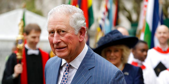 Britain's Prince Charles and Camilla the Duchess of Cornwall, in the background, leave after attending the annual Commonwealth Day service at Westminster Abbey in London, Monday, March 9.