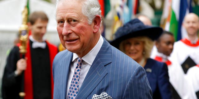 Britain's Prince Charles and Camilla the Duchess of Cornwall, in the background, leave after attending the annual Commonwealth Day service at Westminster Abbey in London, Monday, March 9.