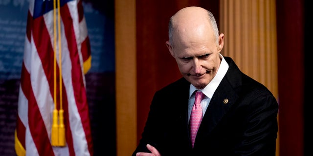 Sen. Rick Scott, R-Fla., attends a news conference about the coronavirus relief bill on Capitol Hill in Washington. (AP Photo/Andrew Harnik)