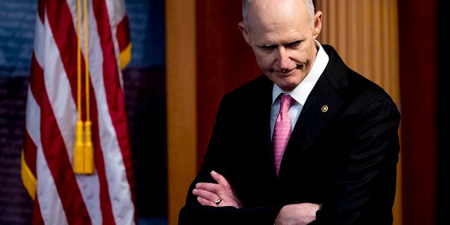 Sen. Rick Scott, R-Fla., attends a news conference about the coronavirus relief bill on Capitol Hill in Washington. (AP Photo/Andrew Harnik)