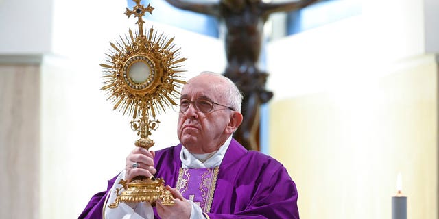 Pope Francis celebrates Mass at his Santa Marta residence, at the Vatican, Thursday, March 26, 2020. 