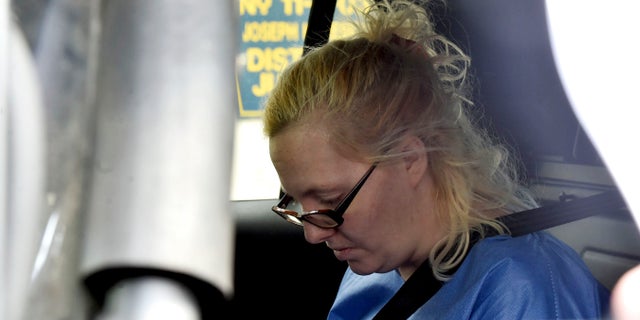 Margaret Ann Cirko sits in a police car after her arrest Thursday in Hanover Township, Pa. (Associated Press)