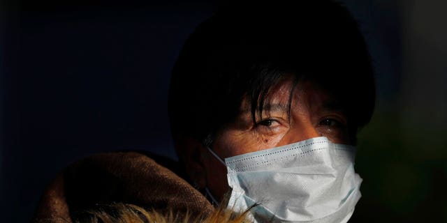 A commuter leaves the Chapultepec subway station wearing a face mask as a precaution amid the spread of the new coronavirus in Mexico City, Friday, March 27, 2020. 