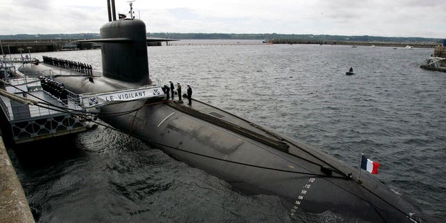 FILE: French Marine officers wait atop "Le Vigilant" nuclear submarine at L'Ile Longue military base, near Brest, Brittany.