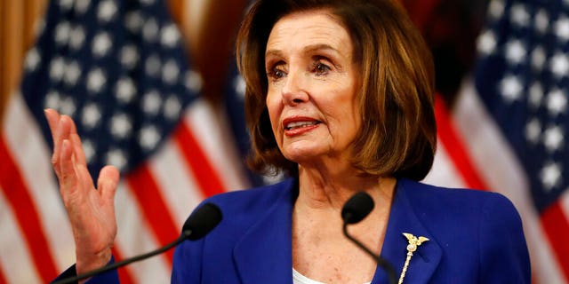 House Speaker Nancy Pelosi, D-Calif., speaks before she signs the Coronavirus Aid, Relief, and Economic Security (CARES) Act after it passed in the House on Capitol Hill, Friday, March 27, 2020. (AP Photo/Andrew Harnik)