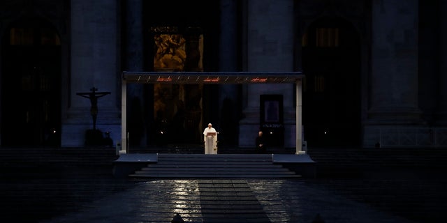 Pope Francis delivers the Urbi and Orbi prayer (Latin for To the City and To the World) in an empty St. Peter's Square, at the Vatican on Friday. Praying in a desolately empty St. Peter's Square, Pope Francis on Friday likened the coronavirus pandemic to a storm laying bare illusions that people can be self-sufficient and instead finds "all of us fragile and disoriented" and needing each other's help and comfort. (AP Photo/Alessandra Tarantino)