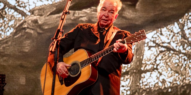 This June 15, 2019 file photo shows John Prine performing at the Bonnaroo Music and Arts Festival in Manchester, Tenn. 