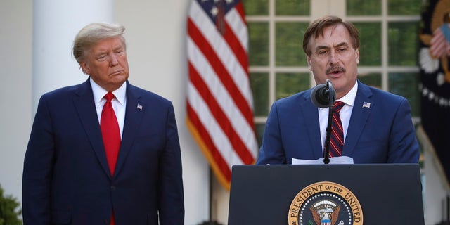 My Pillow CEO Mike Lindell speaks as President Donald Trump listens during a briefing about the coronavirus in the Rose Garden of the White House on Monday. (AP Photo/Alex Brandon)