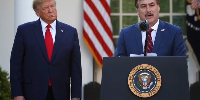 My Pillow CEO Mike Lindell speaks as President Donald Trump listens during a briefing about the coronavirus in the Rose Garden of the White House on Monday. (AP Photo/Alex Brandon)