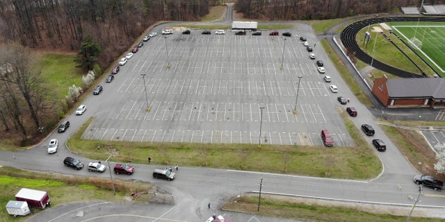 On Monday, parents started lining up at a school in Amherst County, Virginia to pick up computers and other materials for their children to continue with the school curriculum from home. (Amherst Lancers Tech Club)