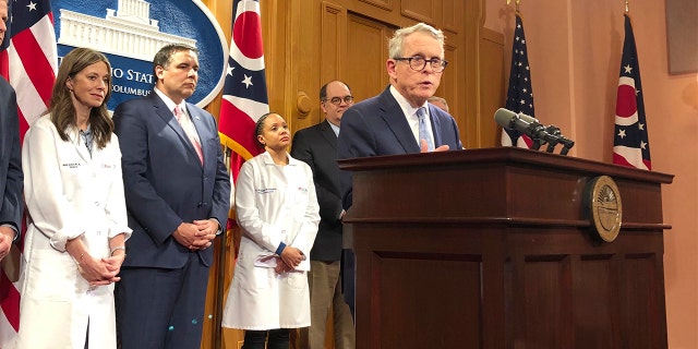 Ohio Gov. Mike DeWine speaks at a news conference at the statehouse in Columbus, Ohio, on Tuesday to announce impacts on the Arnold Sports Festival of the coronavirus. DeWine and organizers of the annual Arnold Sports Festival in Columbus announced that only athletes will be allowed at most of the event scheduled to begin Thursday because of the threat posed by the new coronavirus. (AP Photo/Julie Carr Smyth)