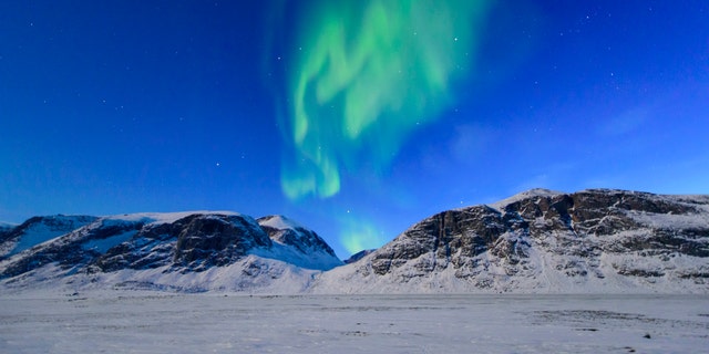 Northern lights over the frozen landscape of Akshayuk Pass, in Auyuittuq National Park on April 8, 2017 on Baffin Island, Canada. -file photo.