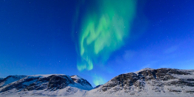 Northern lights over the frozen landscape of Akshayuk Pass, in Auyuittuq National Park on April 8, 2017 on Baffin Island, Canada. -file photo.