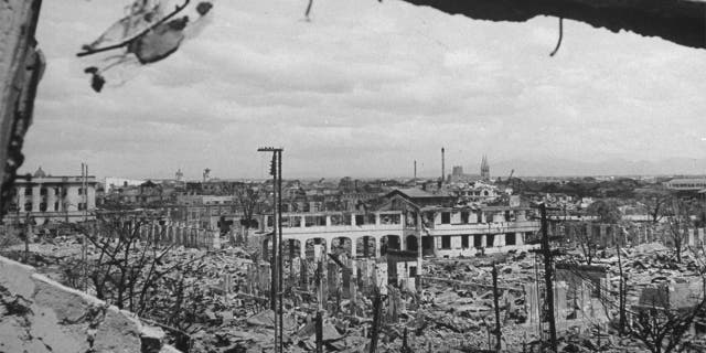 PHILIPPINES - MARCH 1945: Ruins of bombed-out buildings as seen from remains of City Hall, part of the resulting destruction caused by the battles to take back the city from occupying Japanese forces.