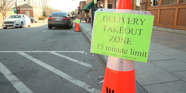 A sign stands outside White Street Brewing Company in Wake Forest, N.C., on Tuesday, March 17, 2020. With bars ordered close due to coronavirus, brewers are making sure their customers can enjoy some fresh suds. (AP Photo/Allen G. Breed)