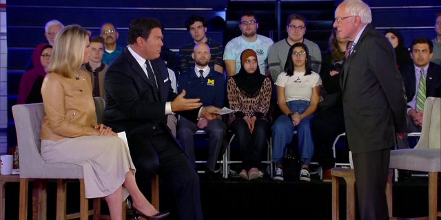 Fox News Channel anchors Bret Baier and Martha MacCallum question Sanders at the Fox News Town Hall on Monday in Detroit, Mich.