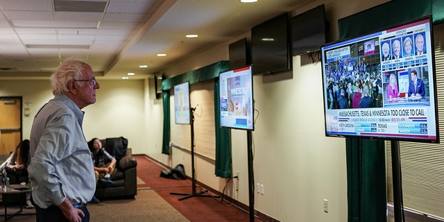 Bernie Sanders watches Super Tuesday results on Fox News in a backstage area during rally in Vermont. (Photo by Salwan Georges/The Washington Post via Getty Images)