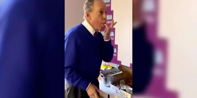 Mike Bloomberg was roasted on social media on Tuesday after a viral video showed him aggressively licking his fingers while eating part of a communal pizza.